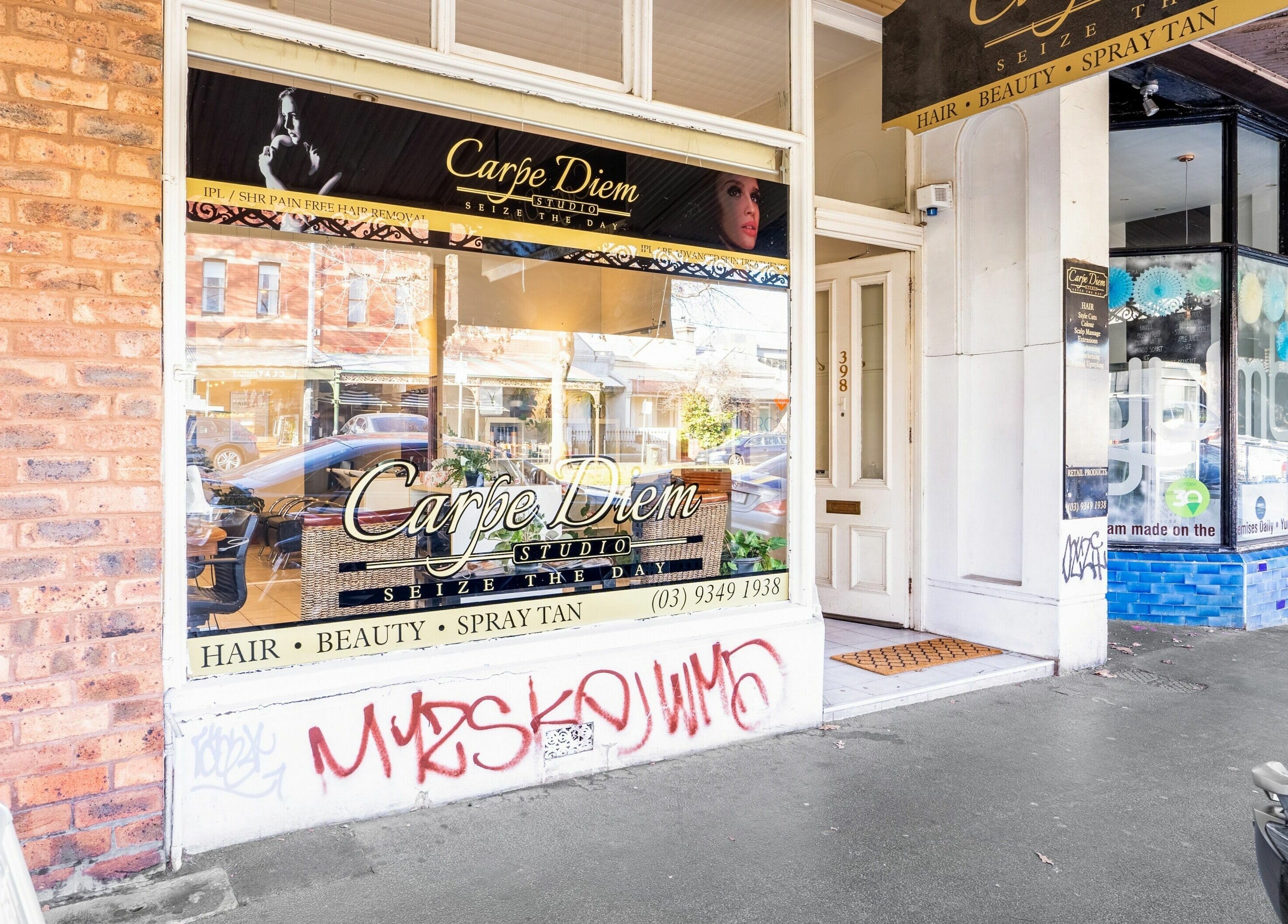 Entrance of Carpe Diem Studio, Melbourne, Victoria, AU, showcasing elegant beauty and hair services.