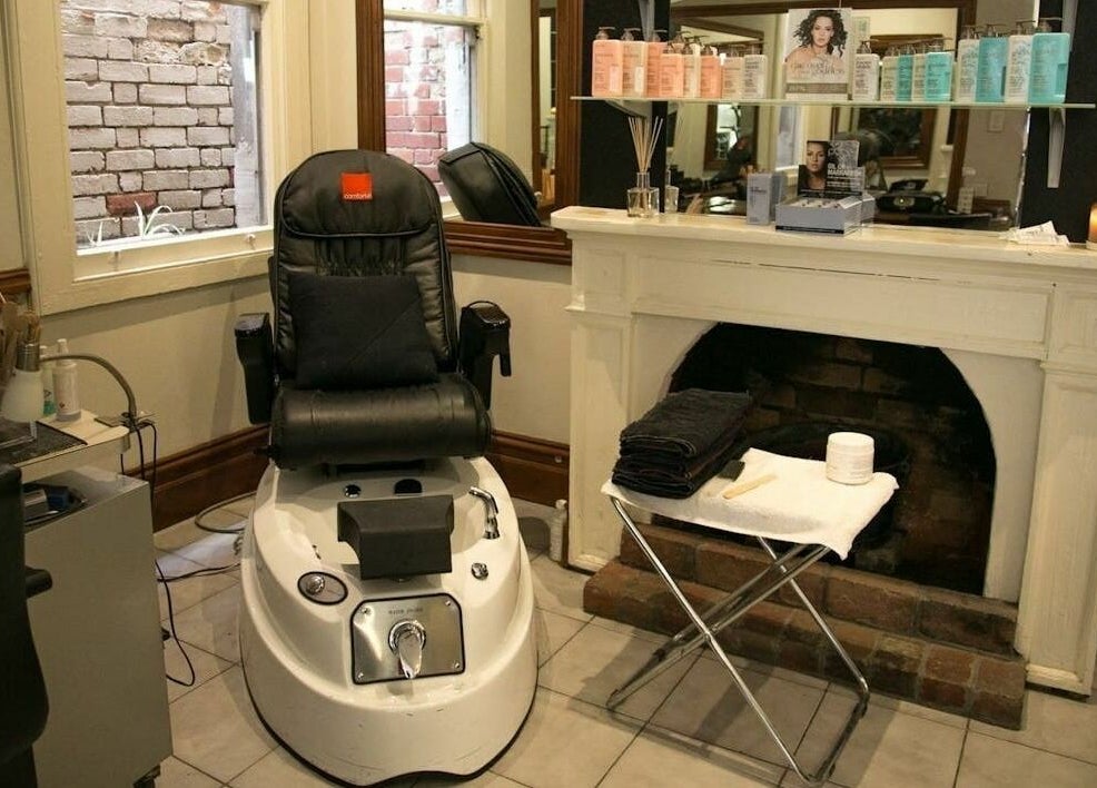 Pedicure station at Carpe Diem Studio, Melbourne, Victoria, AU, featuring a plush chair and spa essentials.