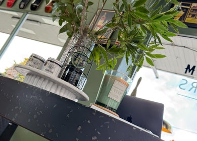 Stylish decor at Mayhem Melbourne (Barbers), Melbourne, Victoria, AU featuring candles and plants.