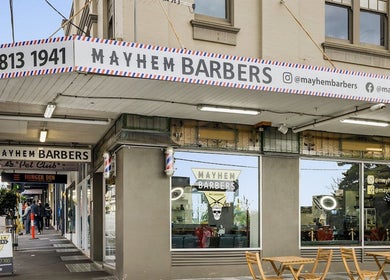 Front facade of Mayhem Melbourne Barbers in Melbourne, Victoria, AU, showcasing its welcoming entry.
