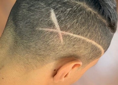 Creative haircut design at Mayhem Melbourne (Barbers), Melbourne, Victoria, AU showcasing intricate patterns.