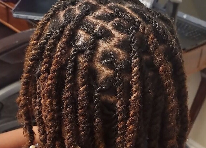 Intricate locs styled at Naturally Loc'd by Ci, Charlotte, North Carolina, US.