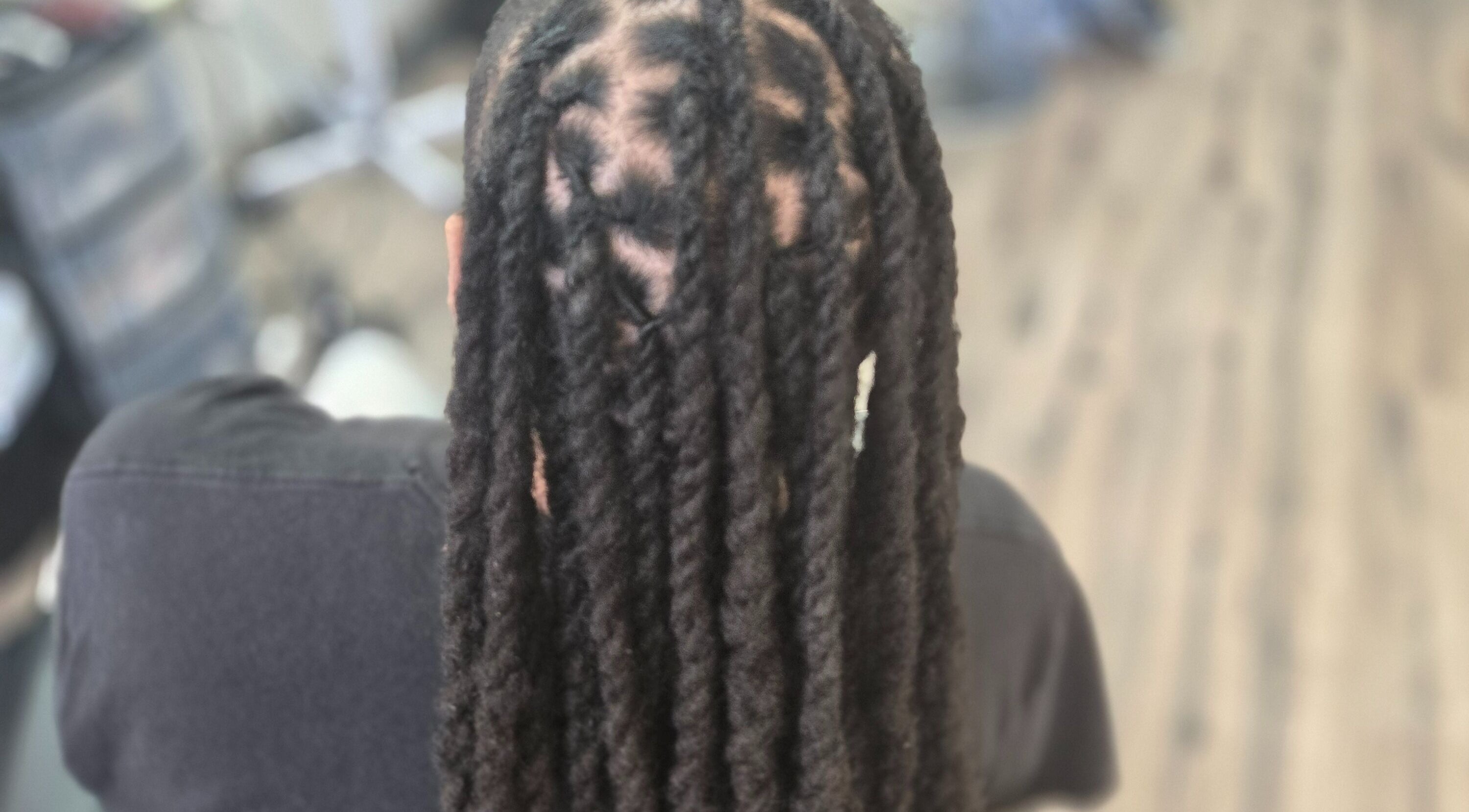 Beautifully styled locs at Naturally Loc'd by Ci in Charlotte, North Carolina, US.