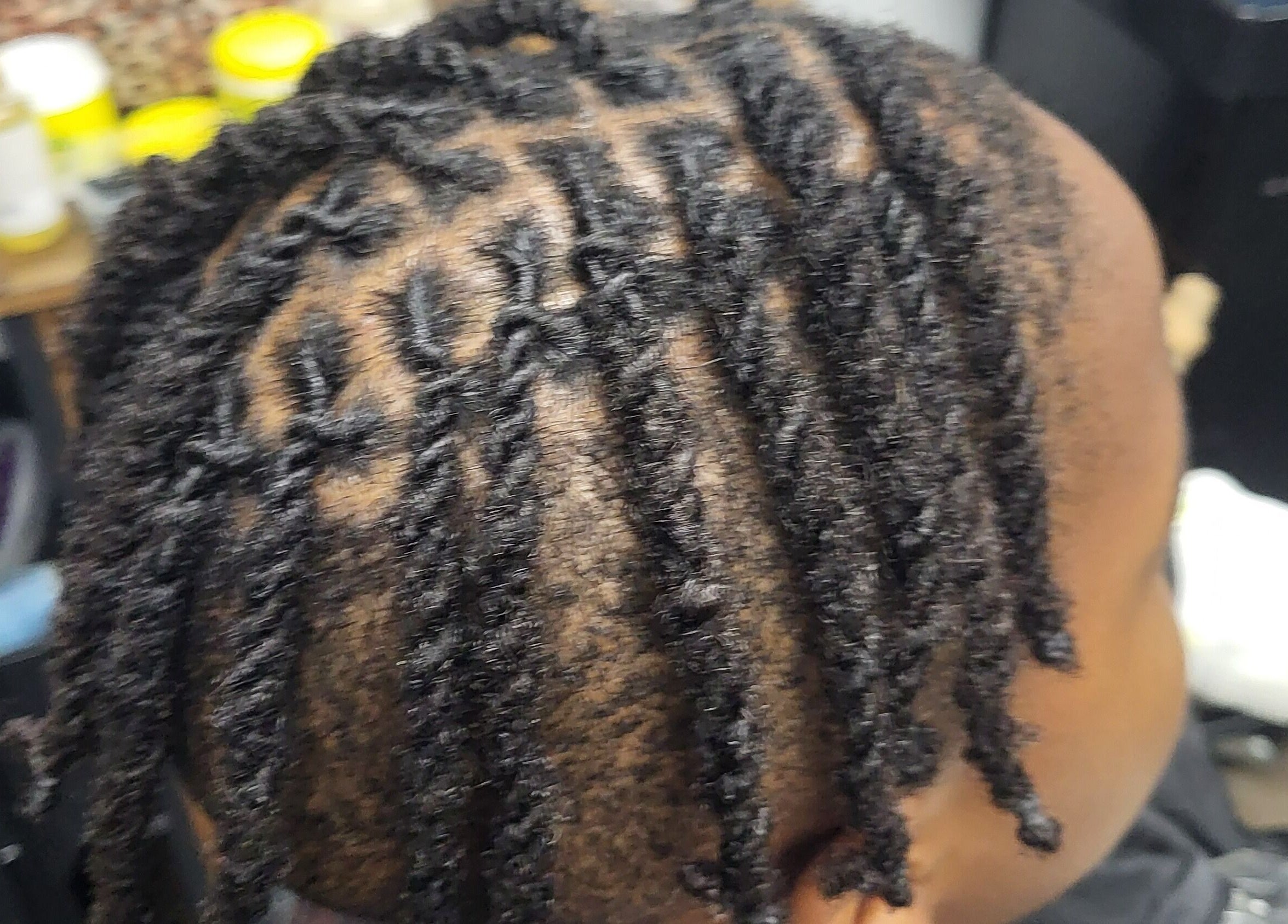 Close-up of intricately styled locs at Naturally Loc'd by Ci in Charlotte, North Carolina, US.