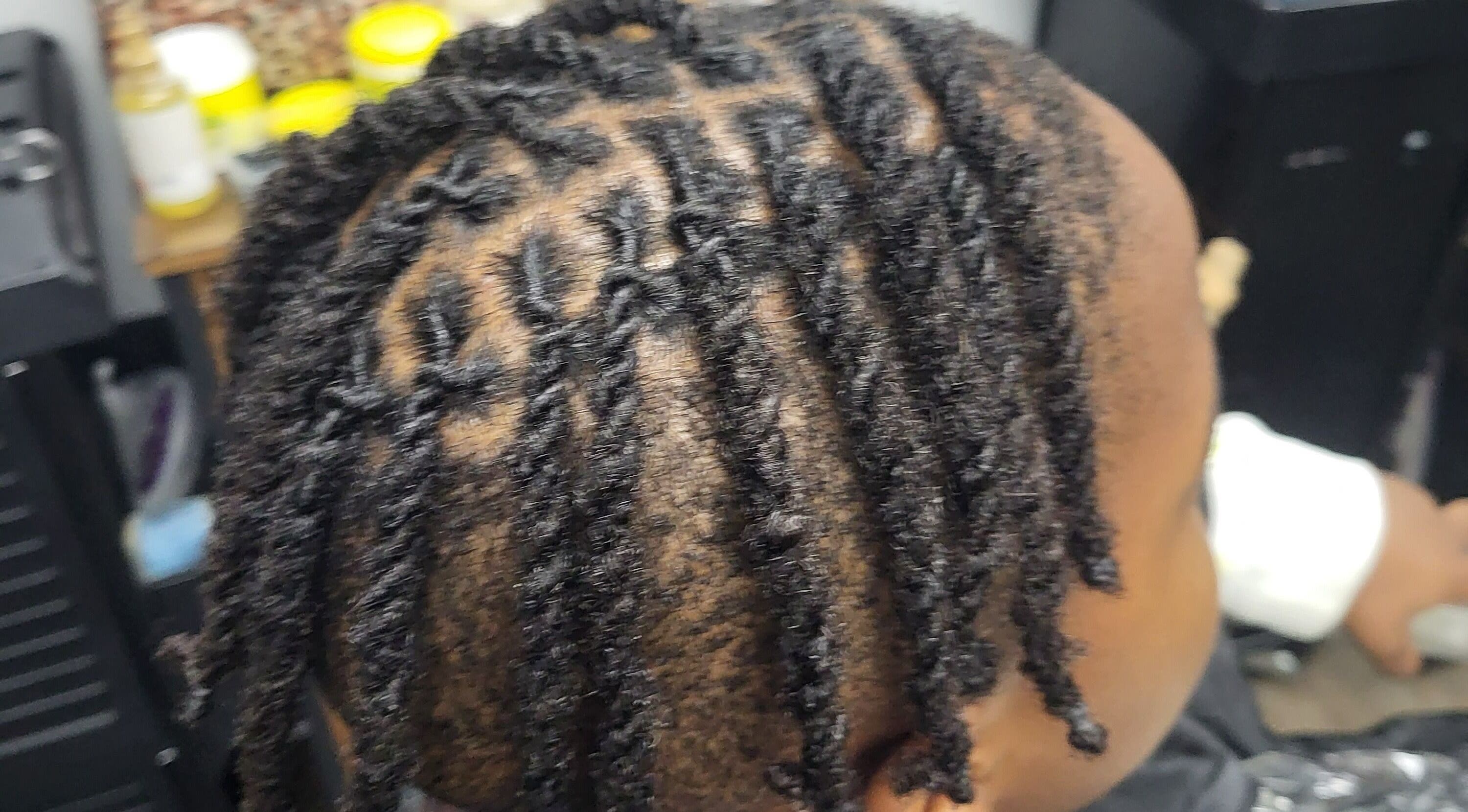 Close-up of intricately styled locs at Naturally Loc'd by Ci in Charlotte, North Carolina, US.