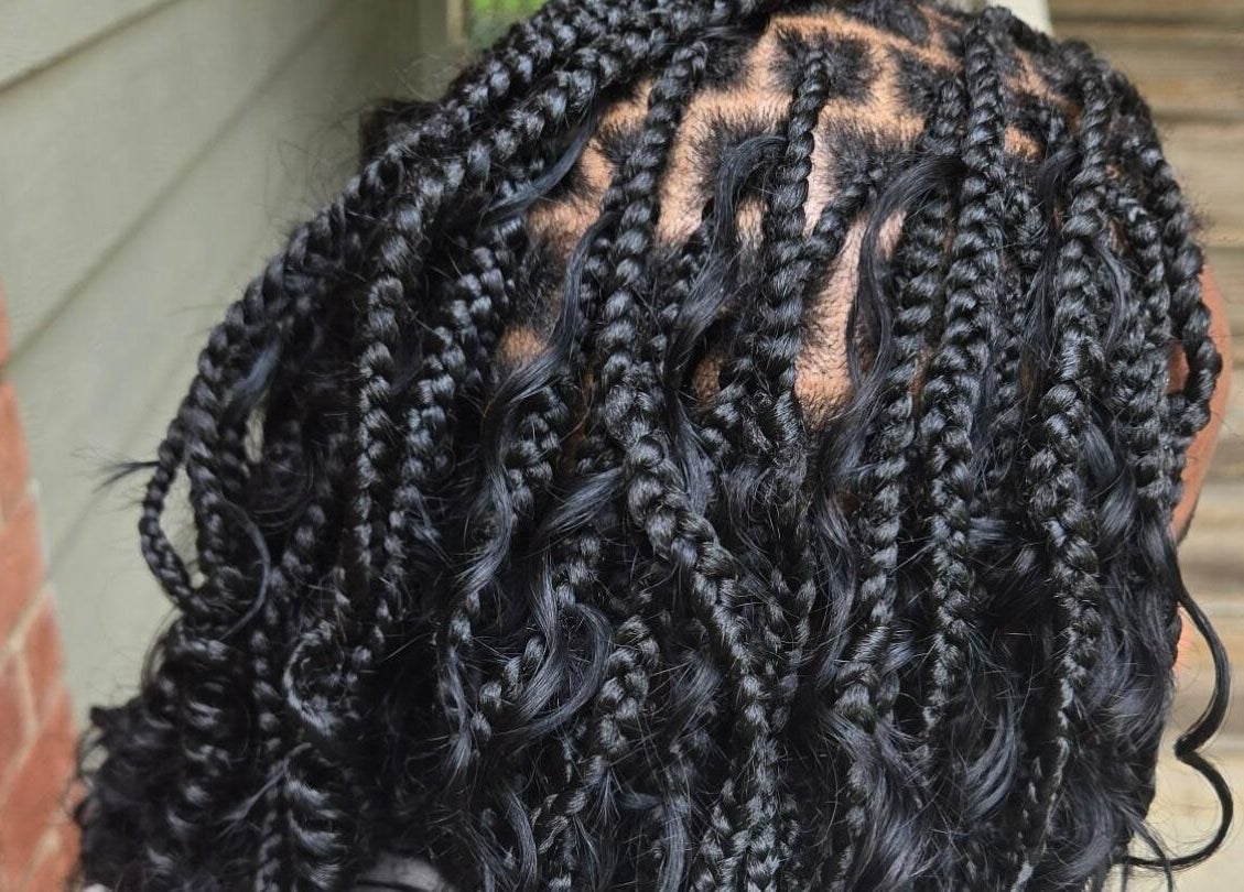 Intricate braided hairstyle at Naturally Loc'd by Ci in Charlotte, North Carolina, US. Perfect blend of style and care.