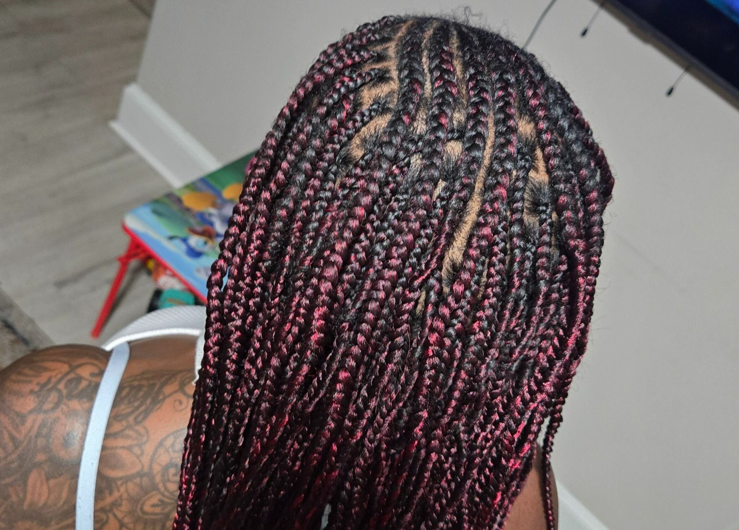 Intricate braid styling at Naturally Loc'd by Ci, Charlotte, North Carolina, US. Stunning back view of braids.
