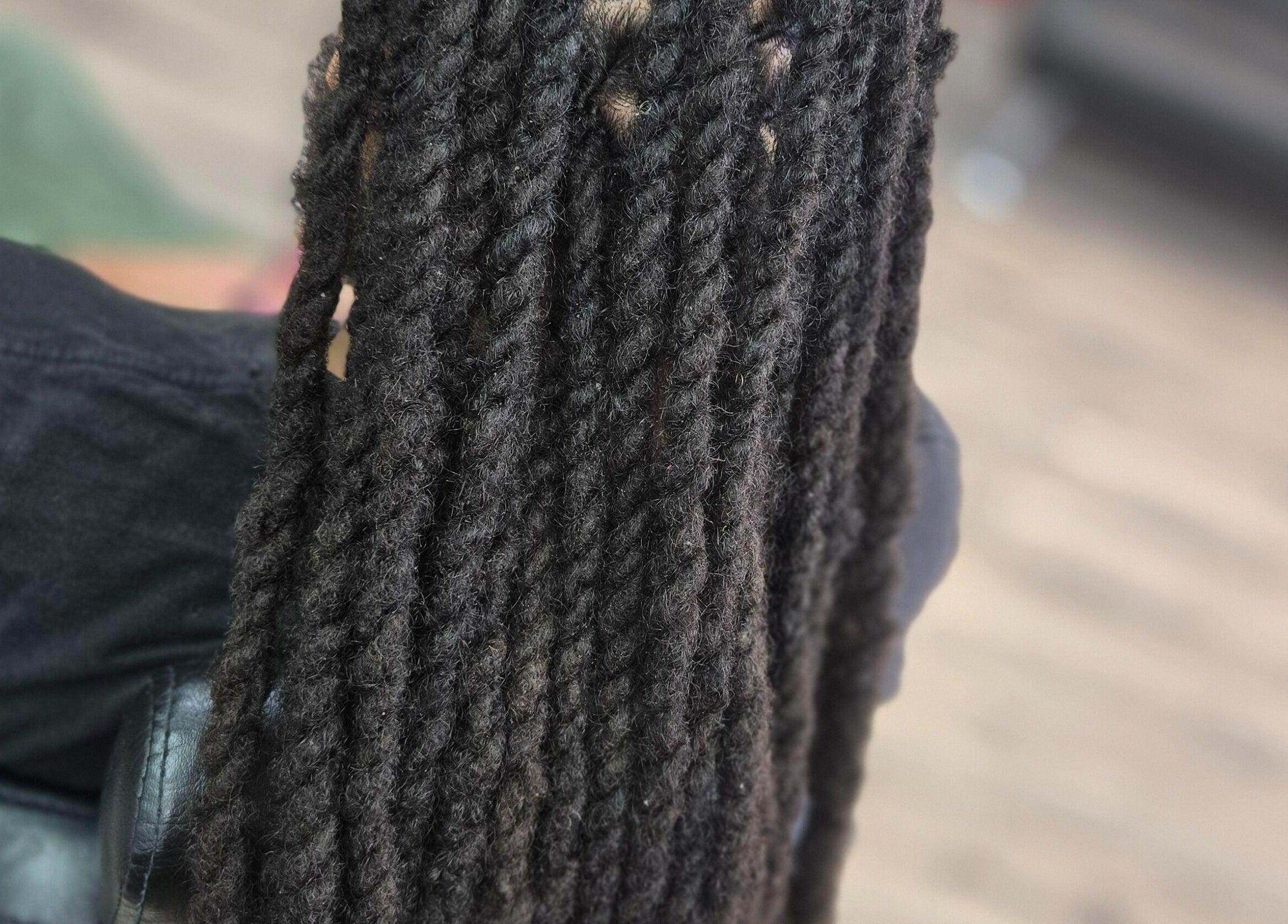Close-up of intricate twists hairstyle at Naturally Loc'd by Ci, Charlotte, North Carolina, US.