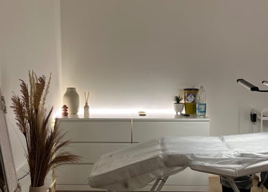 Tranquil treatment room at FIBA Clinic, Leeds, England, GB with serene decor and massage table.