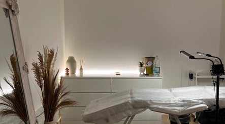 Tranquil treatment room at FIBA Clinic, Leeds, England, GB with serene decor and massage table.