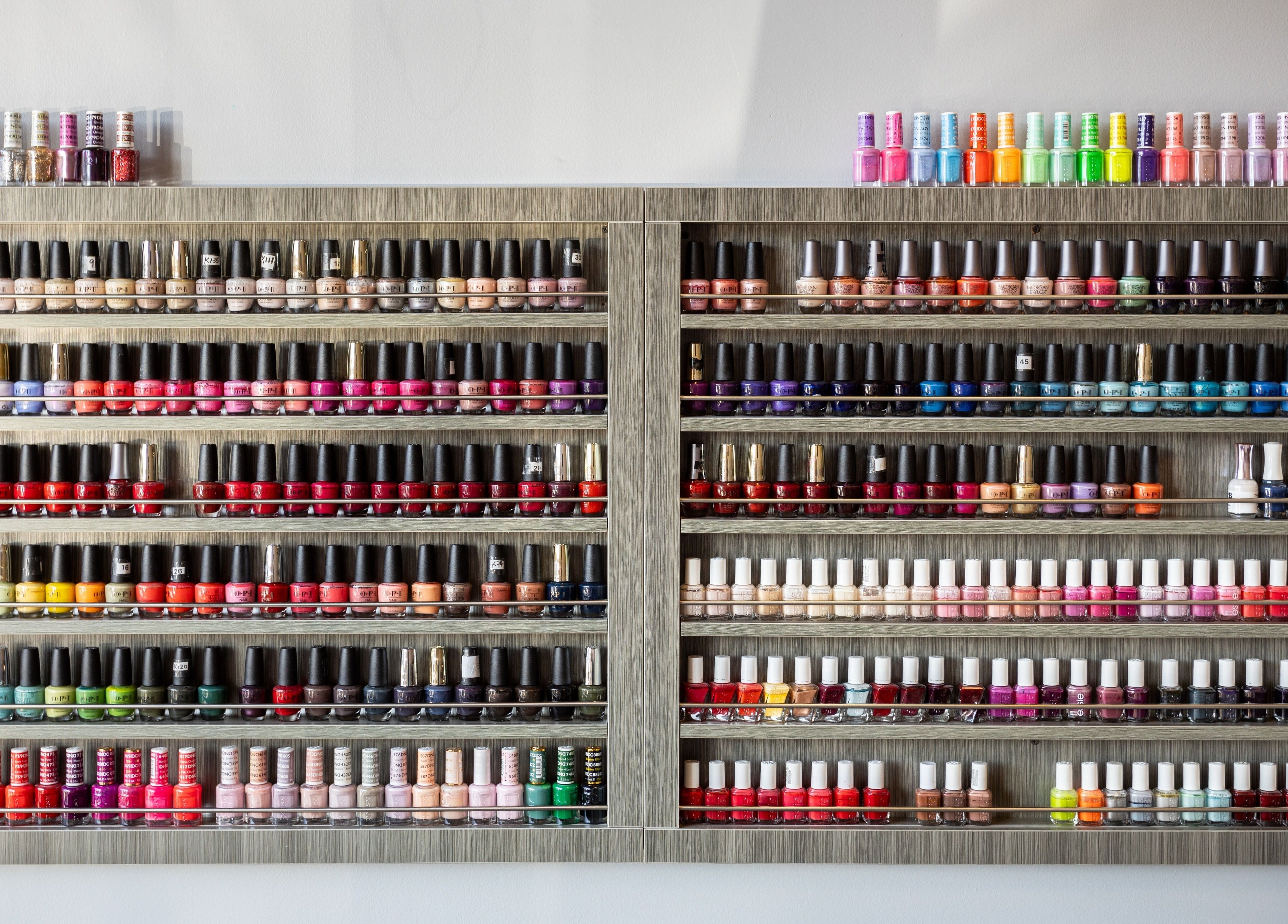 Colorful nail polish display at EG Nails & Spa in Naperville, Illinois, US.