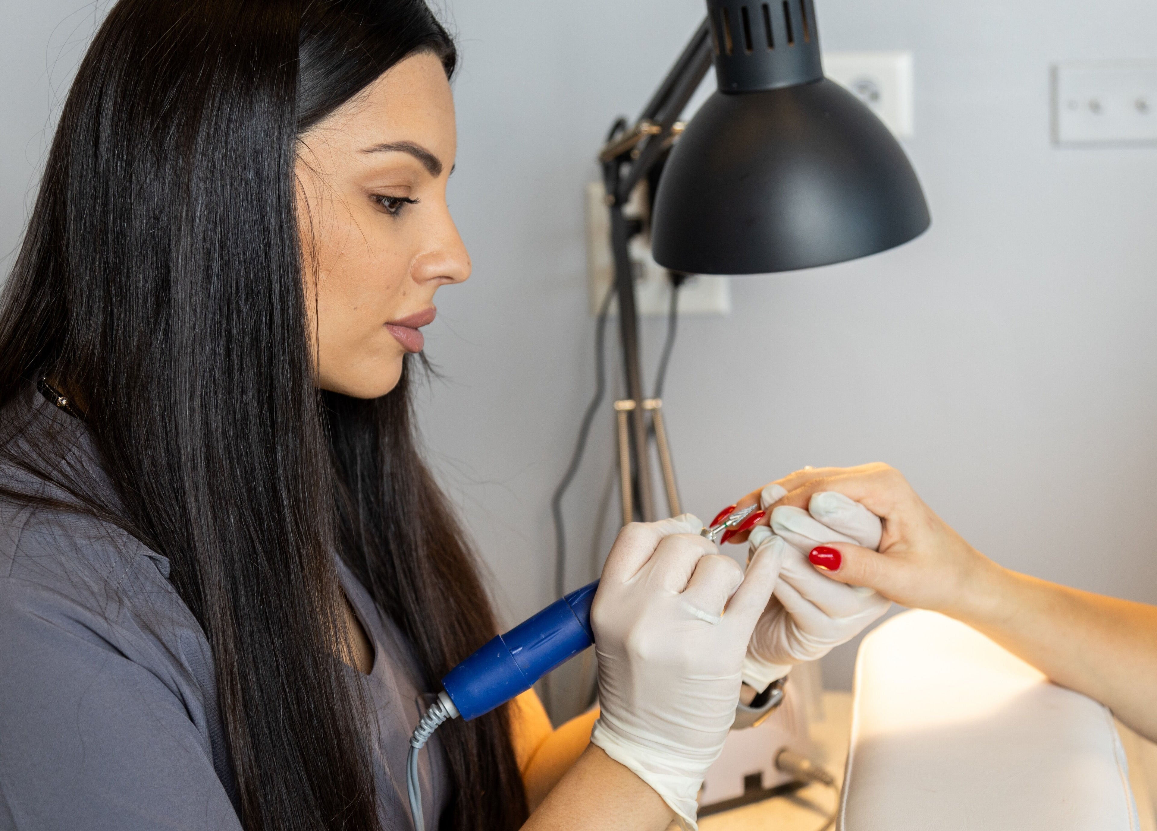 Professional manicure service at EG Nails & Spa in Naperville, Illinois, US. Expert nail care in progress.