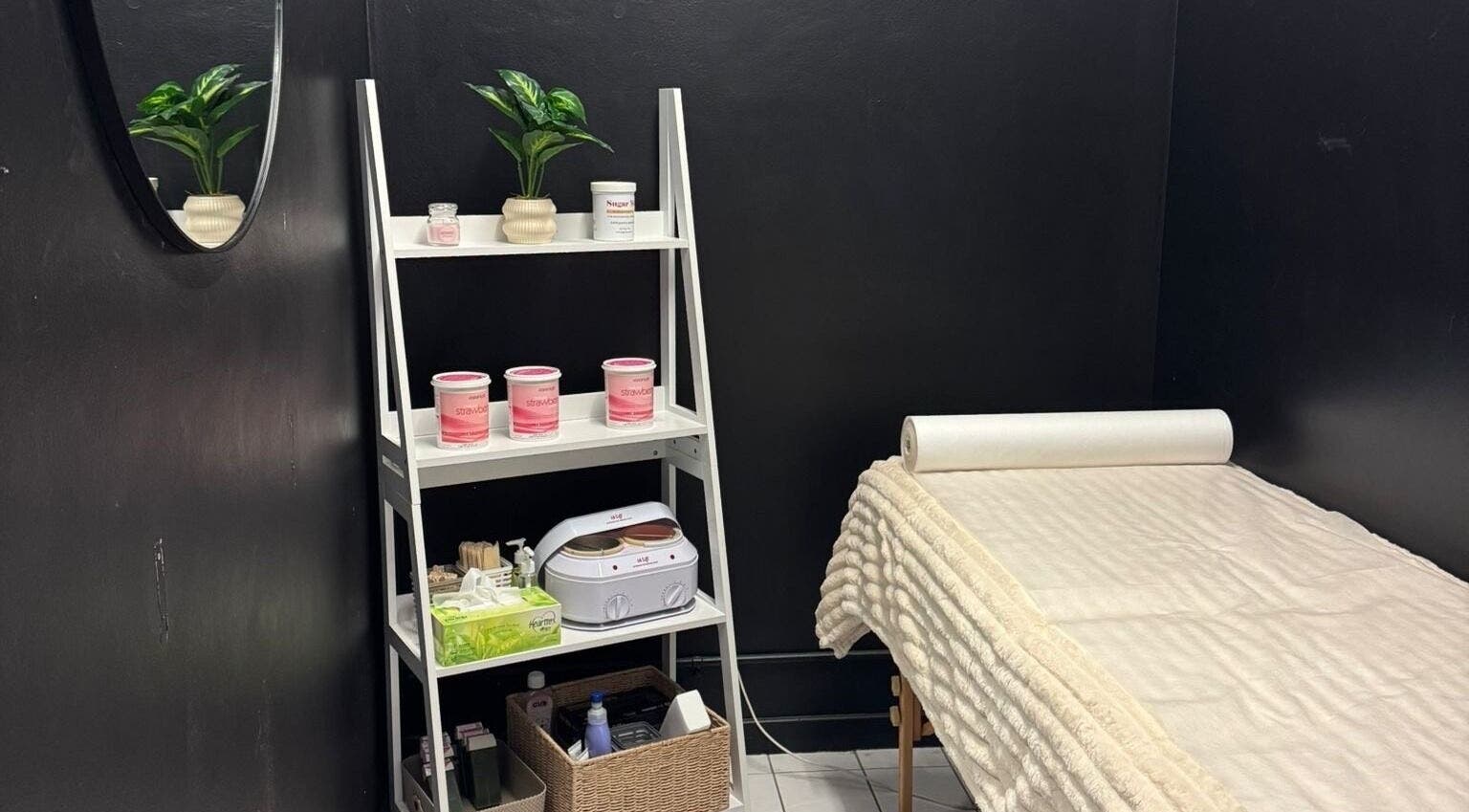 Treatment room at Shellz Brow Bar Bentleigh East with soft bed and product shelf, Bentleigh East, Victoria, AU.