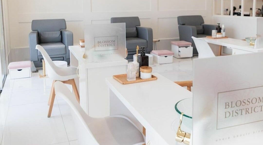 Interior of Blossom District Ladies Salon in Abu Dhabi, AE, featuring elegant seating and modern decor.