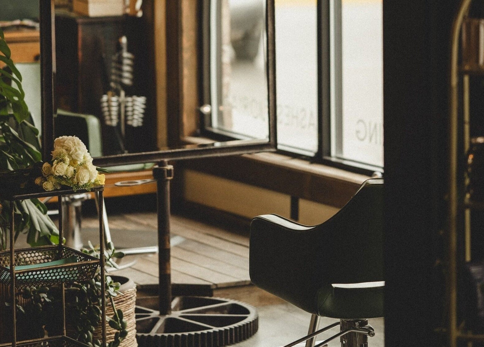 Cozy salon interior with flowers at Pura Vida Salon, Livingston, Montana, US.