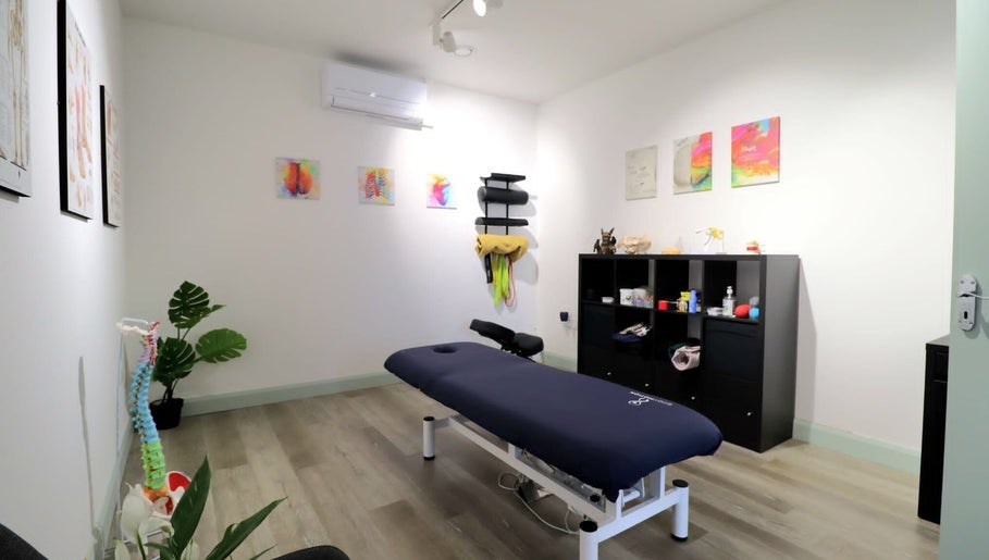 Calming therapy room at Myobody Balance in Drogheda, County Louth, IE, featuring massage table and art.
