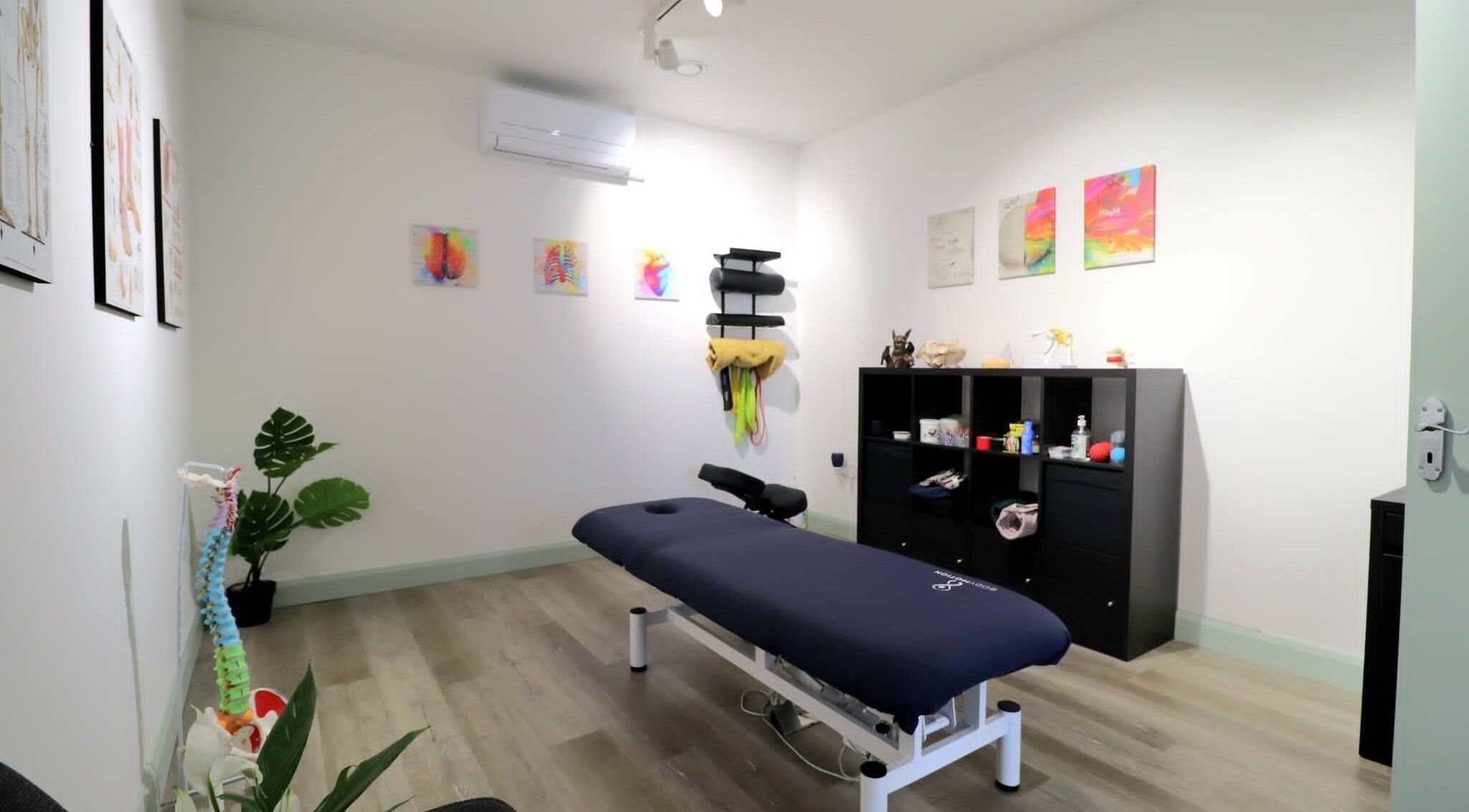 Calming therapy room at Myobody Balance in Drogheda, County Louth, IE, featuring massage table and art.