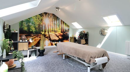 Calming massage room at Myobody Balance in Drogheda, County Louth, IE with nature-themed decor.