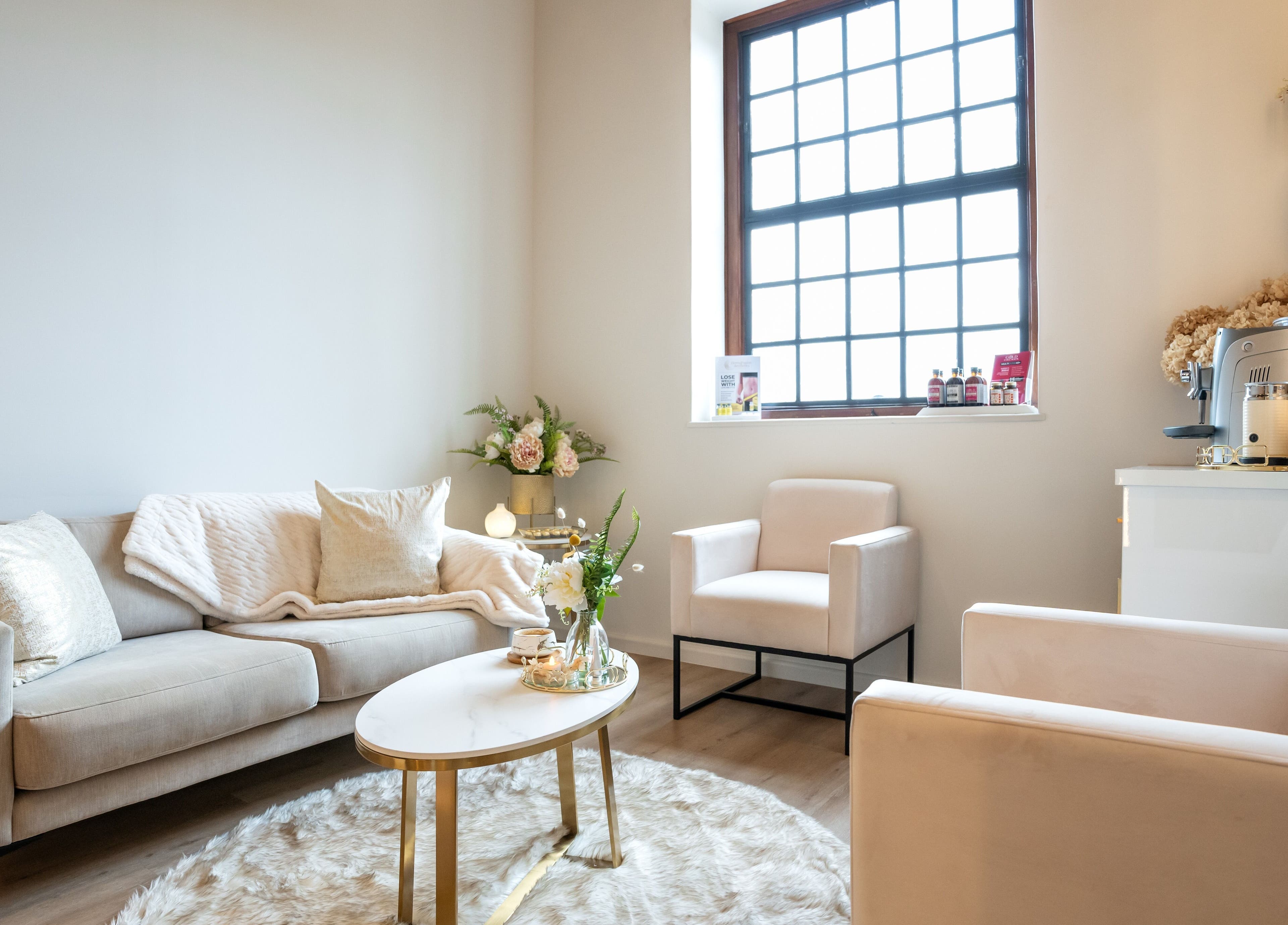 Chic lounge area at Dermafusion Aesthetics, Stellenbosch, Western Cape, ZA, offering comfort and elegance.