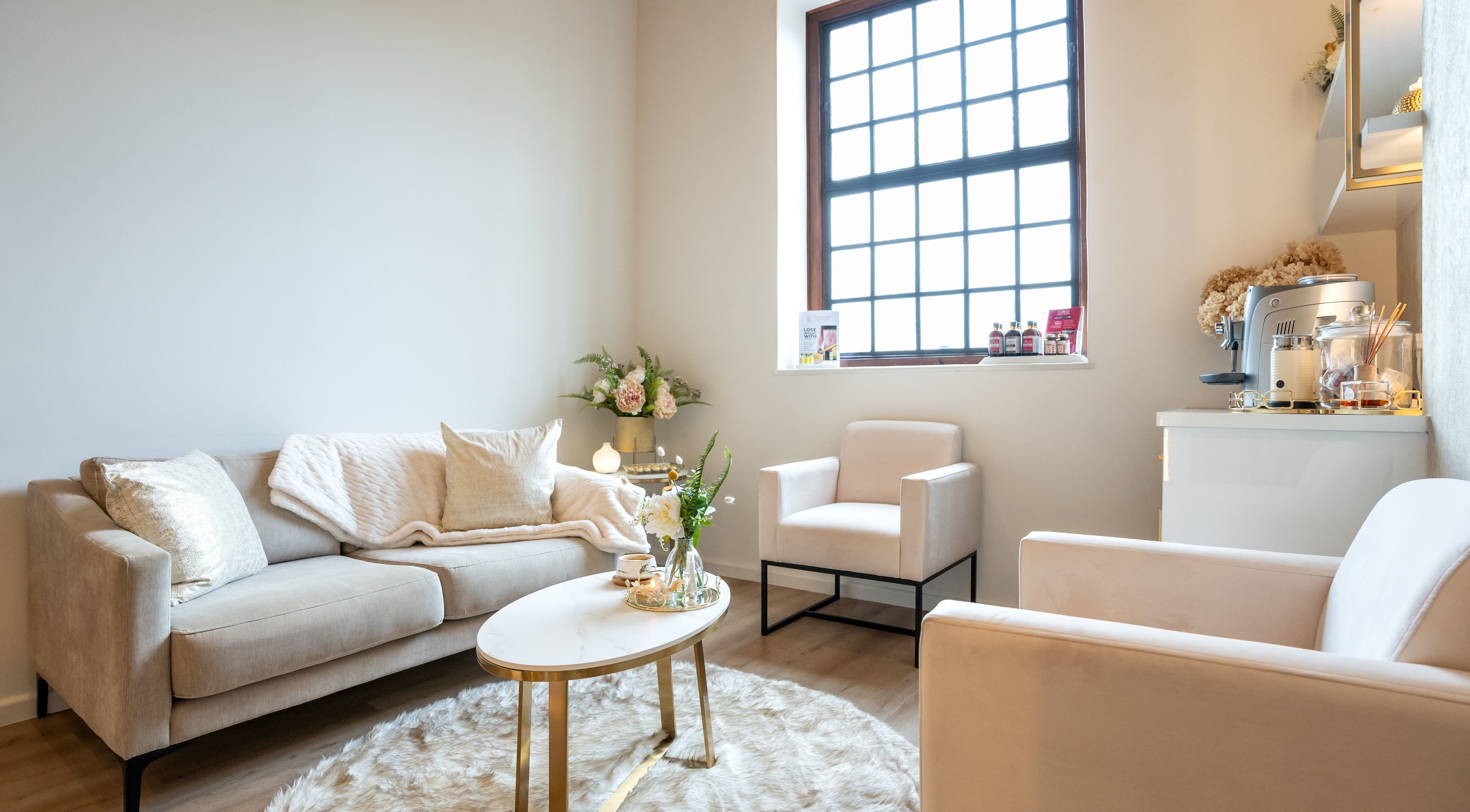 Chic lounge area at Dermafusion Aesthetics, Stellenbosch, Western Cape, ZA, offering comfort and elegance.