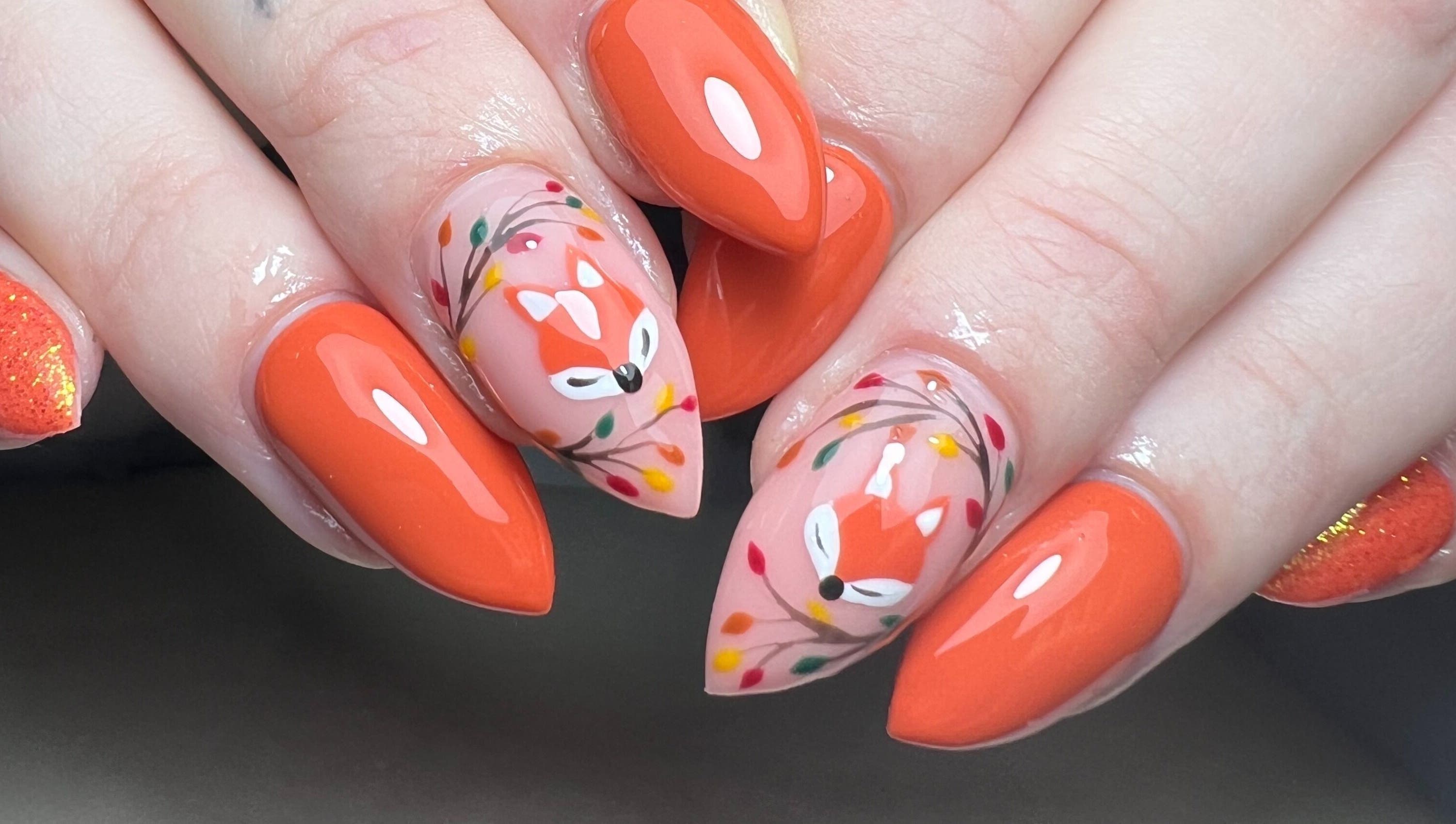 Manicured nails with fox and floral art at Moo Nails & Beauty, Exeter, England, GB.