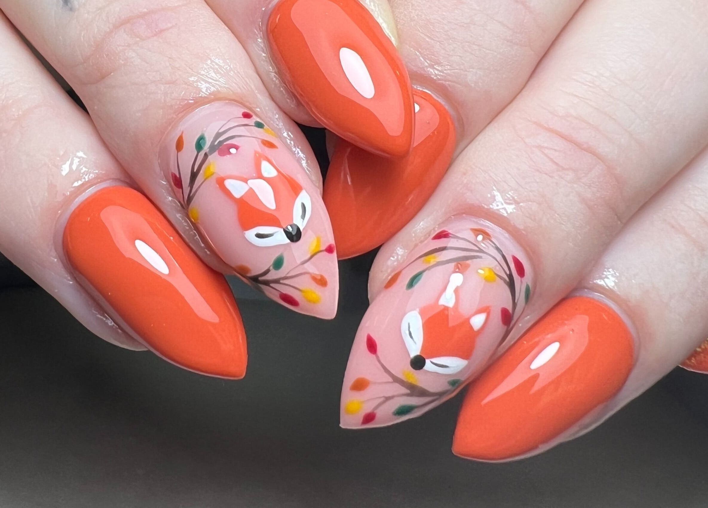 Manicured nails with fox and floral art at Moo Nails & Beauty, Exeter, England, GB.