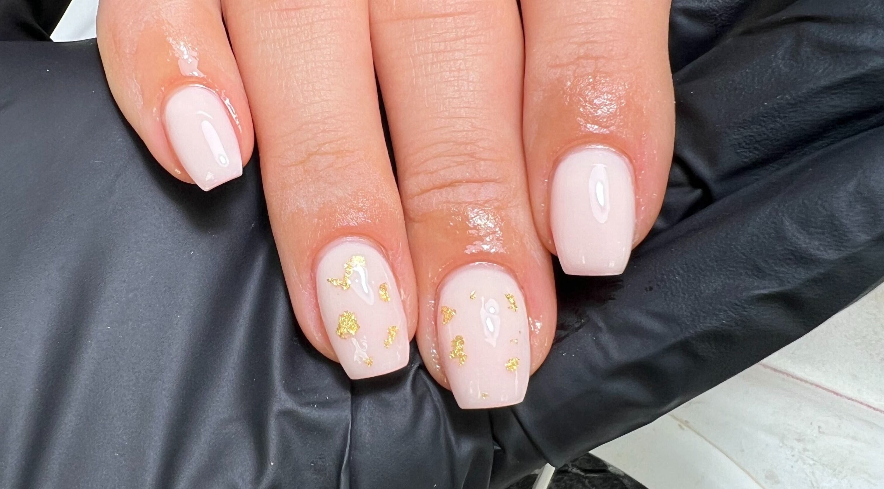 Elegant nude nails with gold accents at Moo Nails & Beauty, Exeter, England, GB.