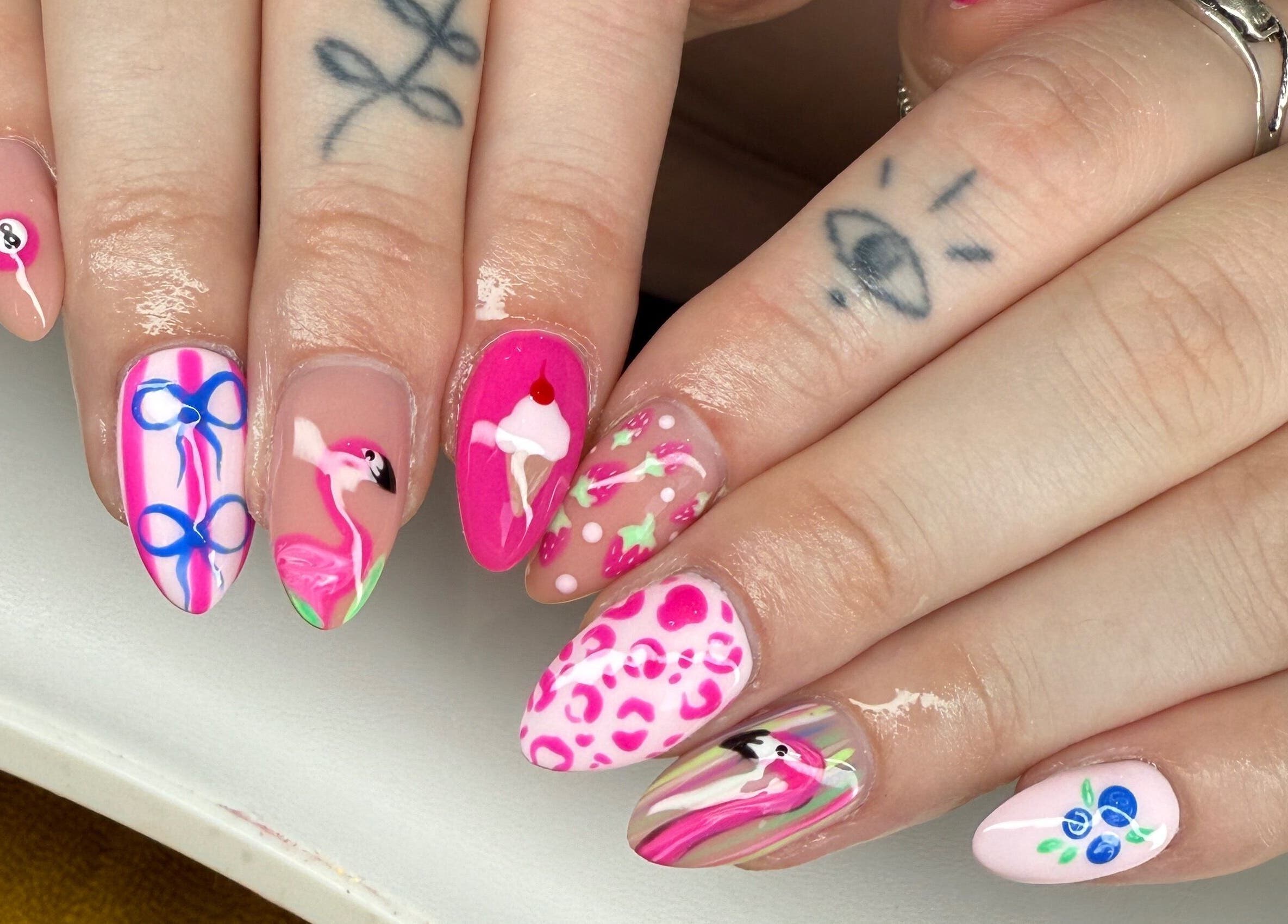 Colorful nail art at Moo Nails & Beauty, Exeter, England, GB, showcasing flamingo design and unique patterns.