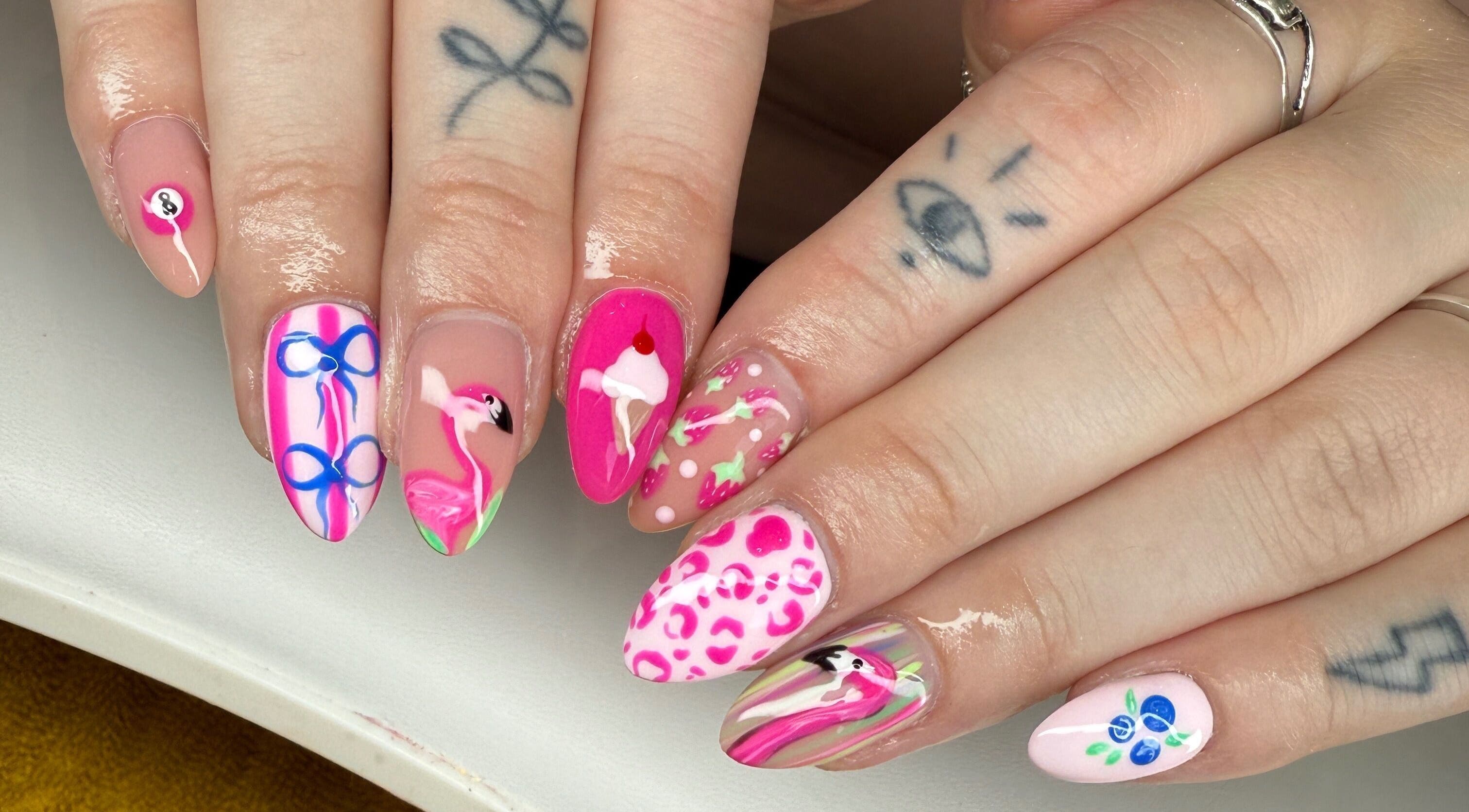 Colorful nail art at Moo Nails & Beauty, Exeter, England, GB, showcasing flamingo design and unique patterns.