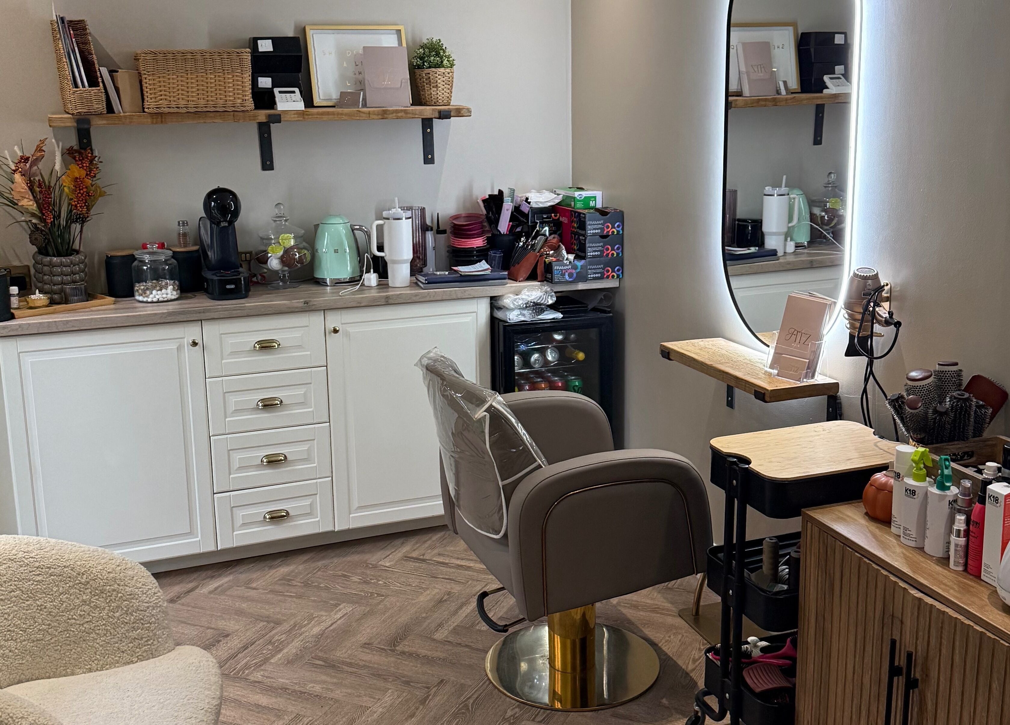 Chic interior of Kate Fitzpatrick Hair in Deeside, Wales, GB with elegant styling chair and modern décor.