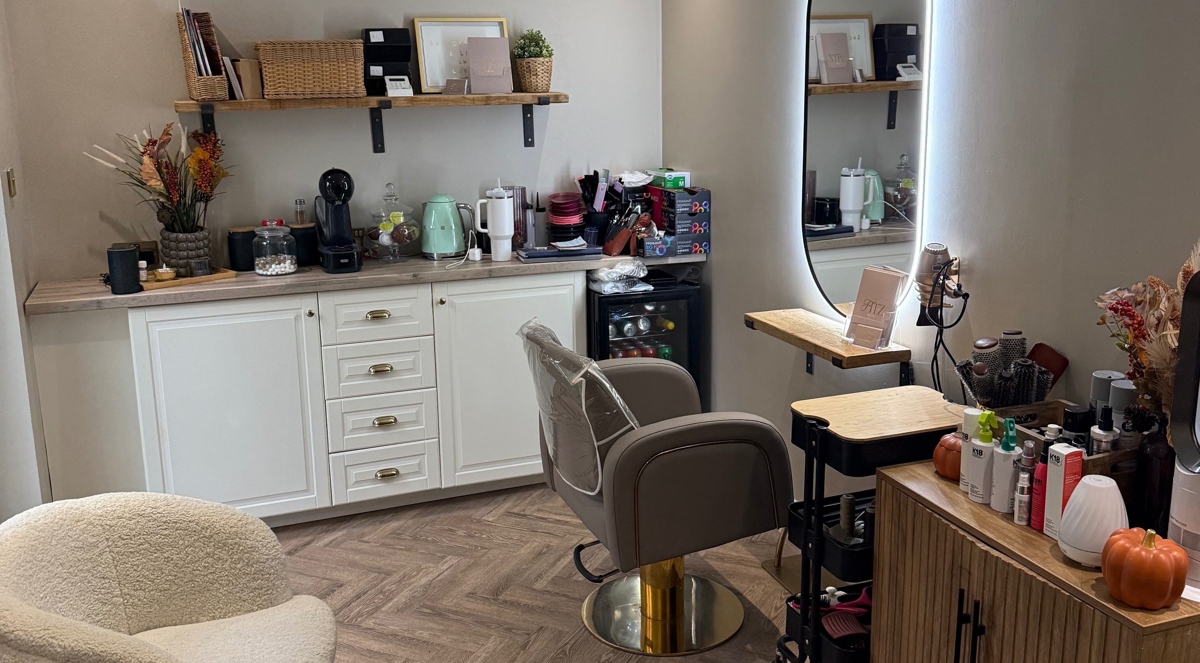 Chic interior of Kate Fitzpatrick Hair in Deeside, Wales, GB with elegant styling chair and modern décor.