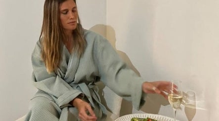 Woman in robe enjoying relaxation at Seu Momento Beauty, Subiaco, Western Australia, AU.