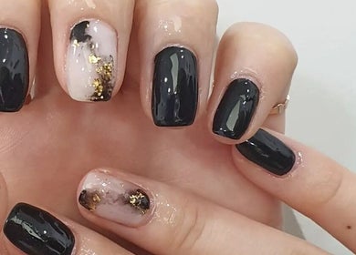 Chic nail art design featuring dark and gold accents at Seu Momento Beauty, Subiaco, Western Australia, AU.
