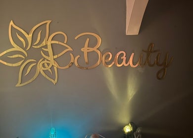 Golden LBeauty logo on wall at LBeauty, Limerick, County Limerick, IE.