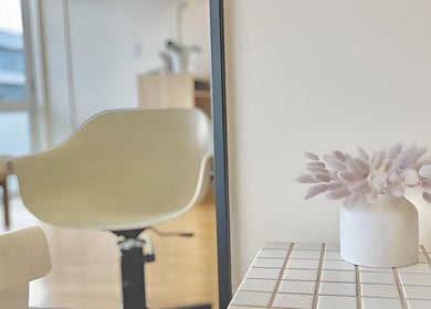 Modern chair and floral decor at Muse Hair Studio, Bay of Plenty, Bay of Plenty, NZ.