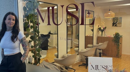 Exterior of Muse Hair Studio, Bay of Plenty, NZ, showcasing stylish decor and welcoming atmosphere.