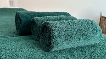 Luxurious green towels at Orchard Holistic Therapy in Waterlooville, England, GB. Perfect for a relaxing experience.