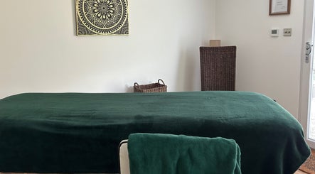 Tranquil therapy room at Orchard Holistic Therapy in Waterlooville, England, GB with a massage table.