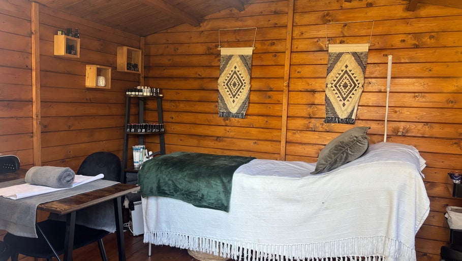 Cozy treatment room at Nails&Glow Beauty, Bristol, England, GB featuring a wooden decor and wellness setup.