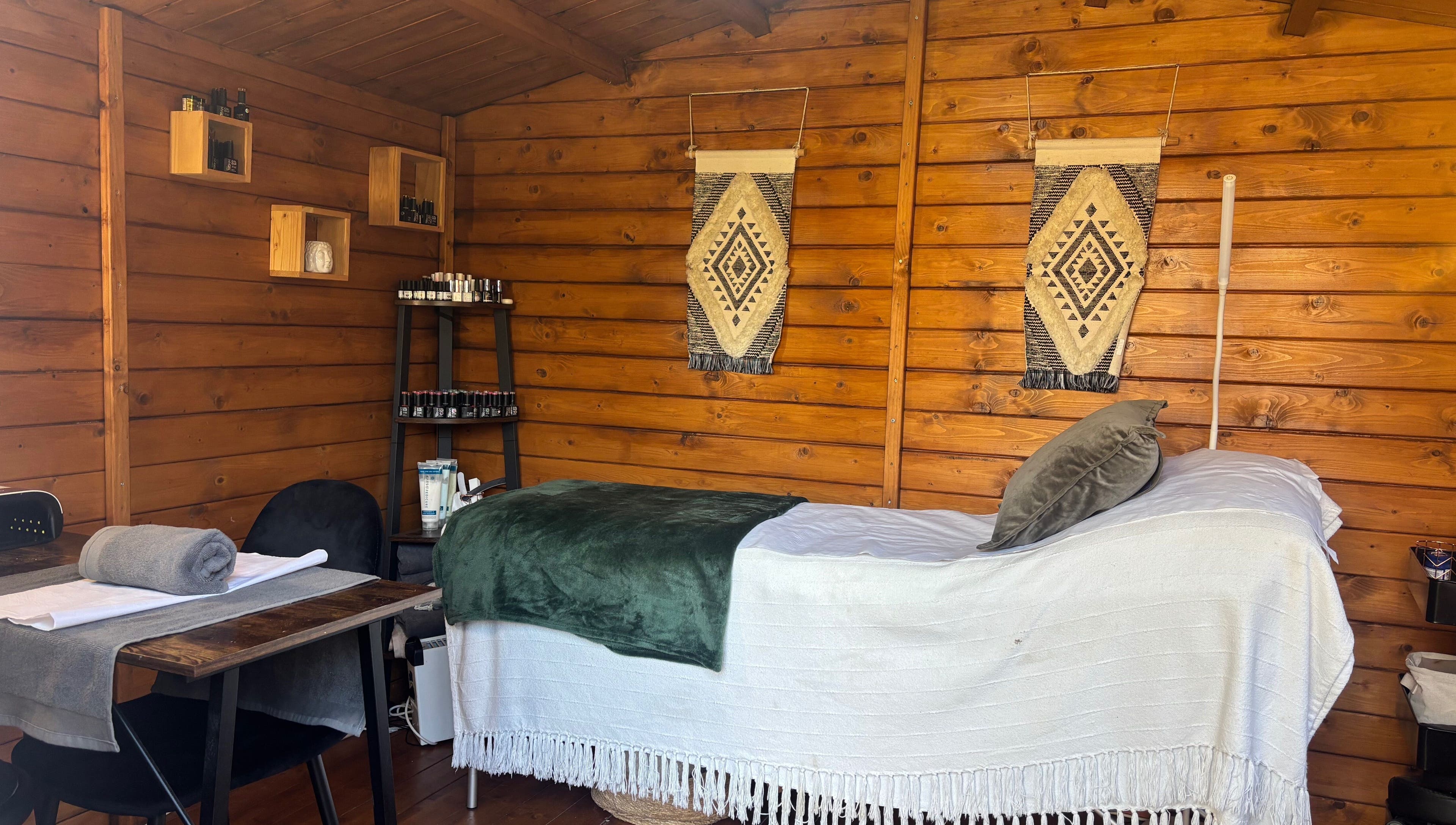 Cozy treatment room at Nails&Glow Beauty, Bristol, England, GB featuring a wooden decor and wellness setup.