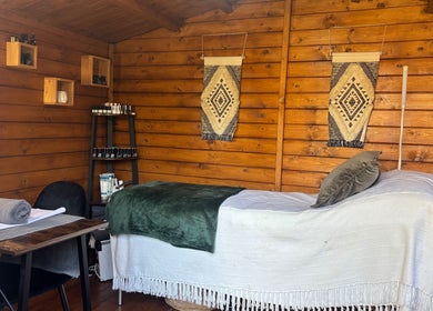 Cozy treatment room at Nails&Glow Beauty, Bristol, England, GB featuring a wooden decor and wellness setup.