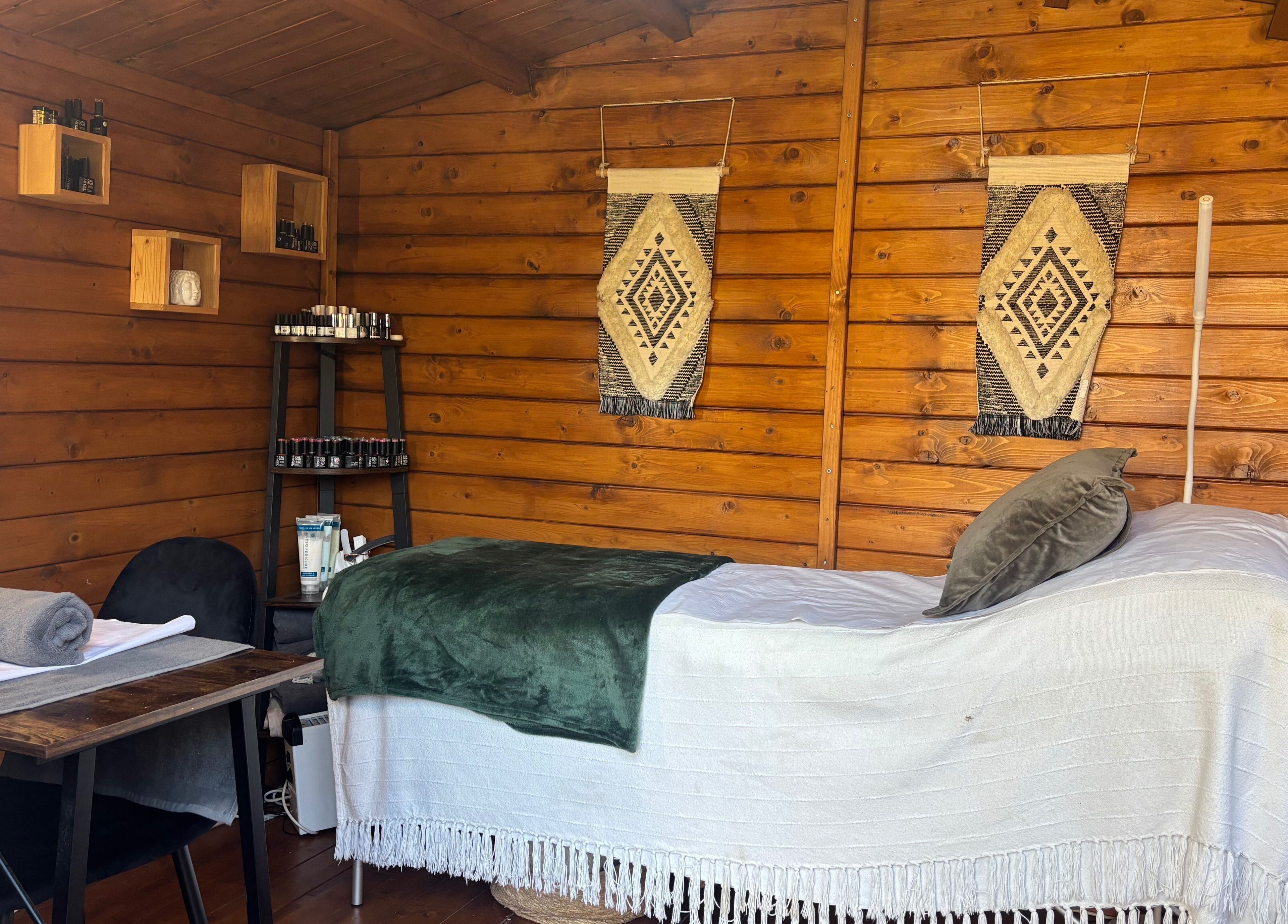 Cozy treatment room at Nails&Glow Beauty, Bristol, England, GB featuring a wooden decor and wellness setup.