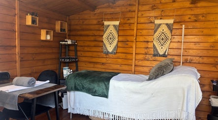 Cozy treatment room at Nails&Glow Beauty, Bristol, England, GB featuring a wooden decor and wellness setup.