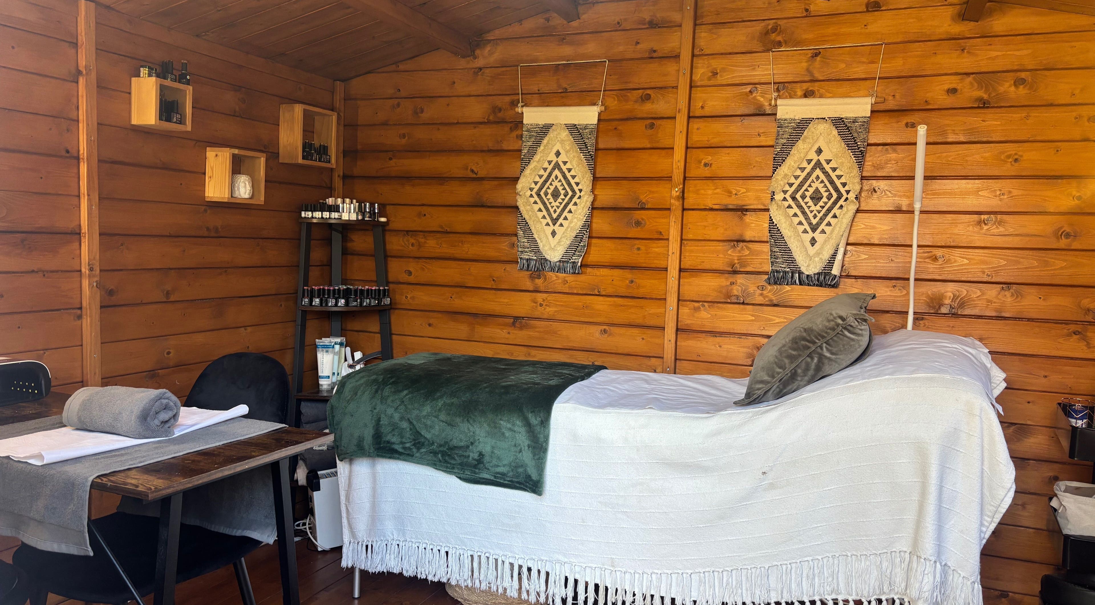 Cozy treatment room at Nails&Glow Beauty, Bristol, England, GB featuring a wooden decor and wellness setup.