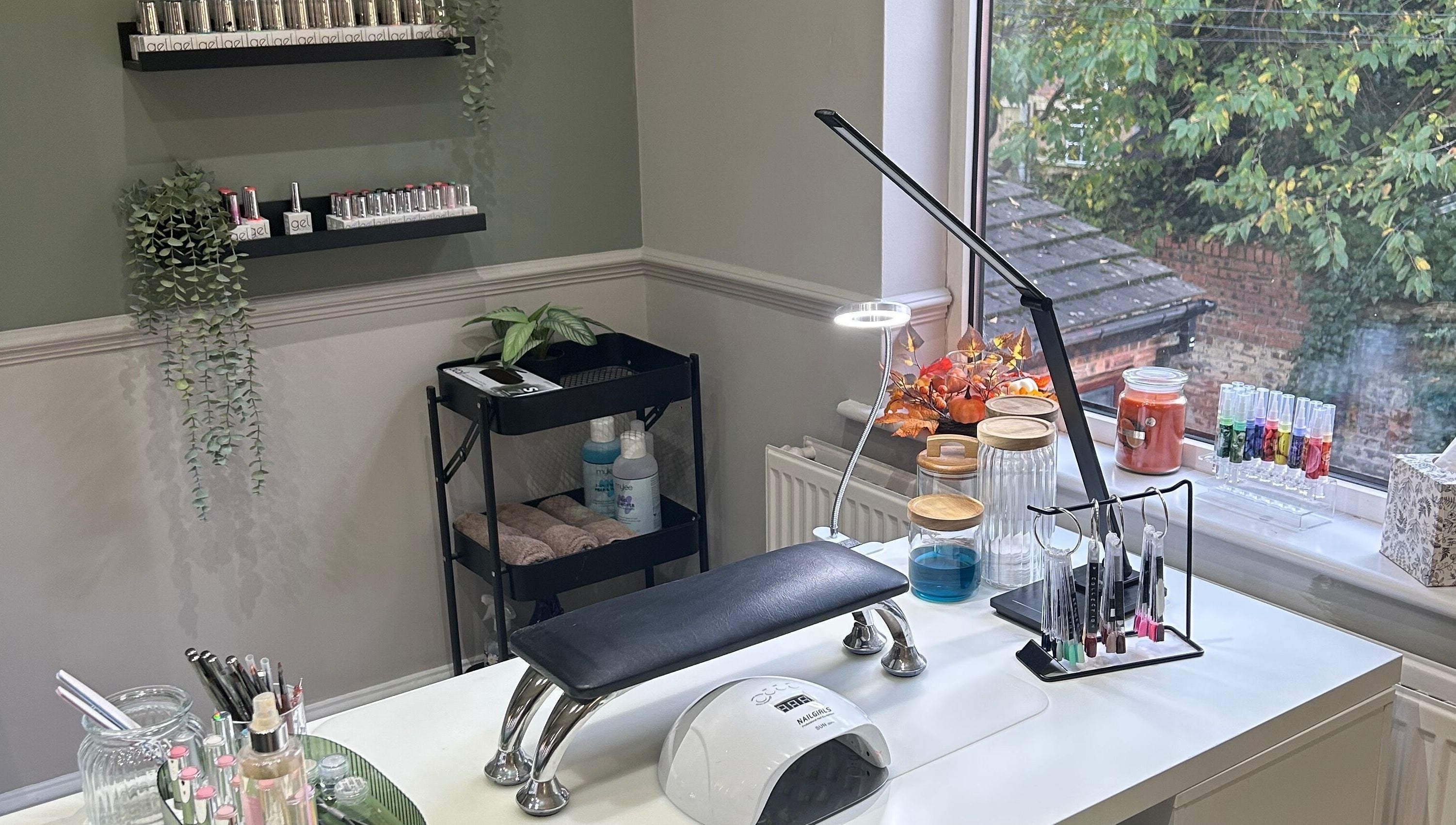 Chic nail workspace at Eden By Elizabeth, Newton-le-Willows, England, GB, with tools and greenery.