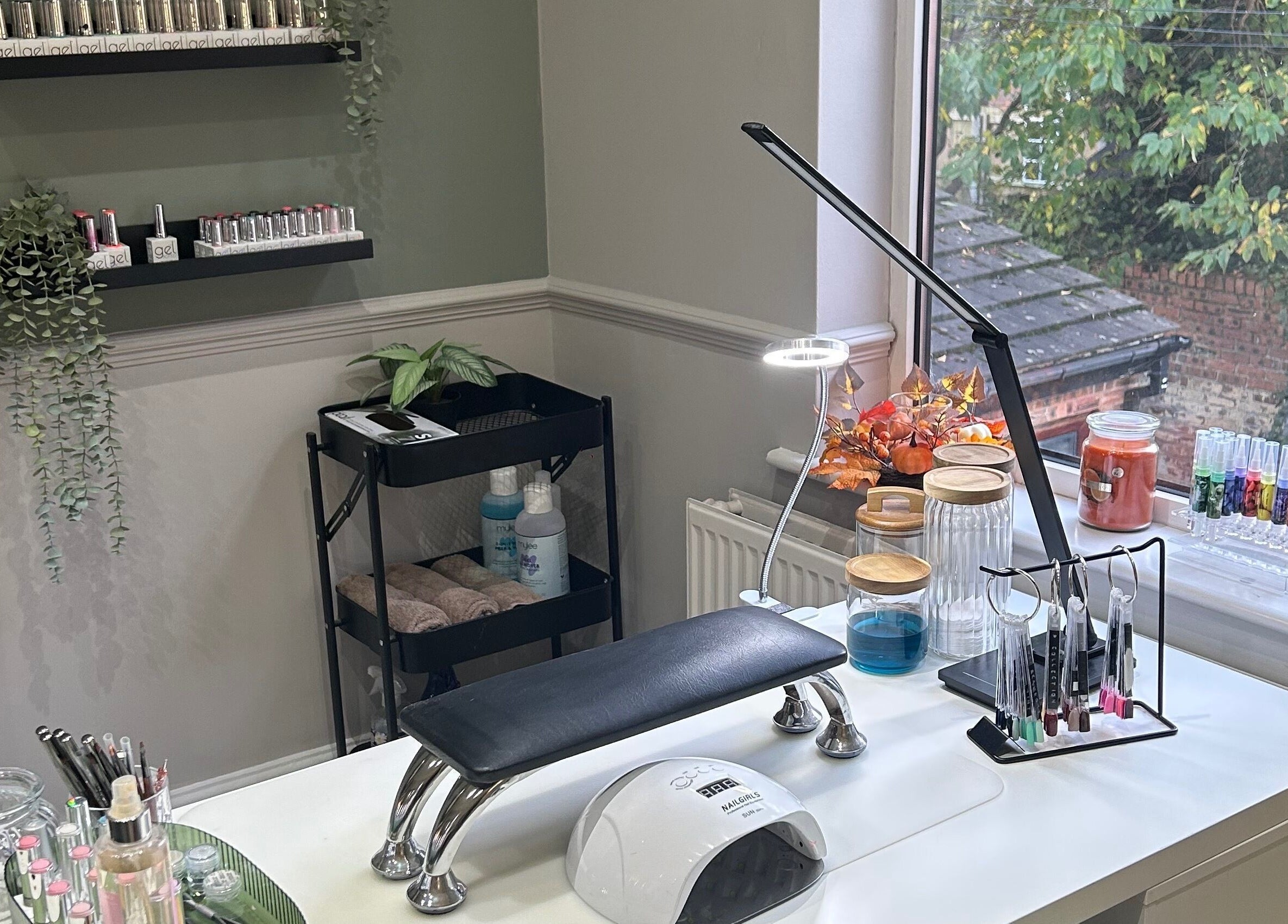 Chic nail workspace at Eden By Elizabeth, Newton-le-Willows, England, GB, with tools and greenery.