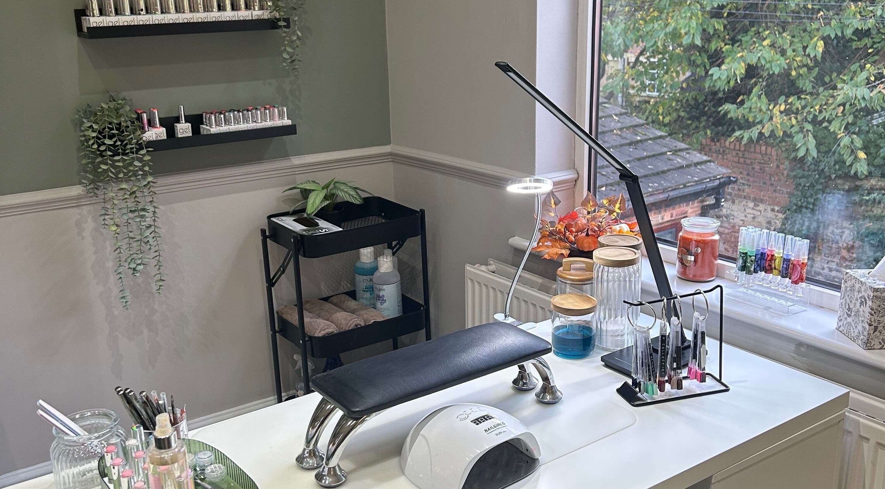 Chic nail workspace at Eden By Elizabeth, Newton-le-Willows, England, GB, with tools and greenery.