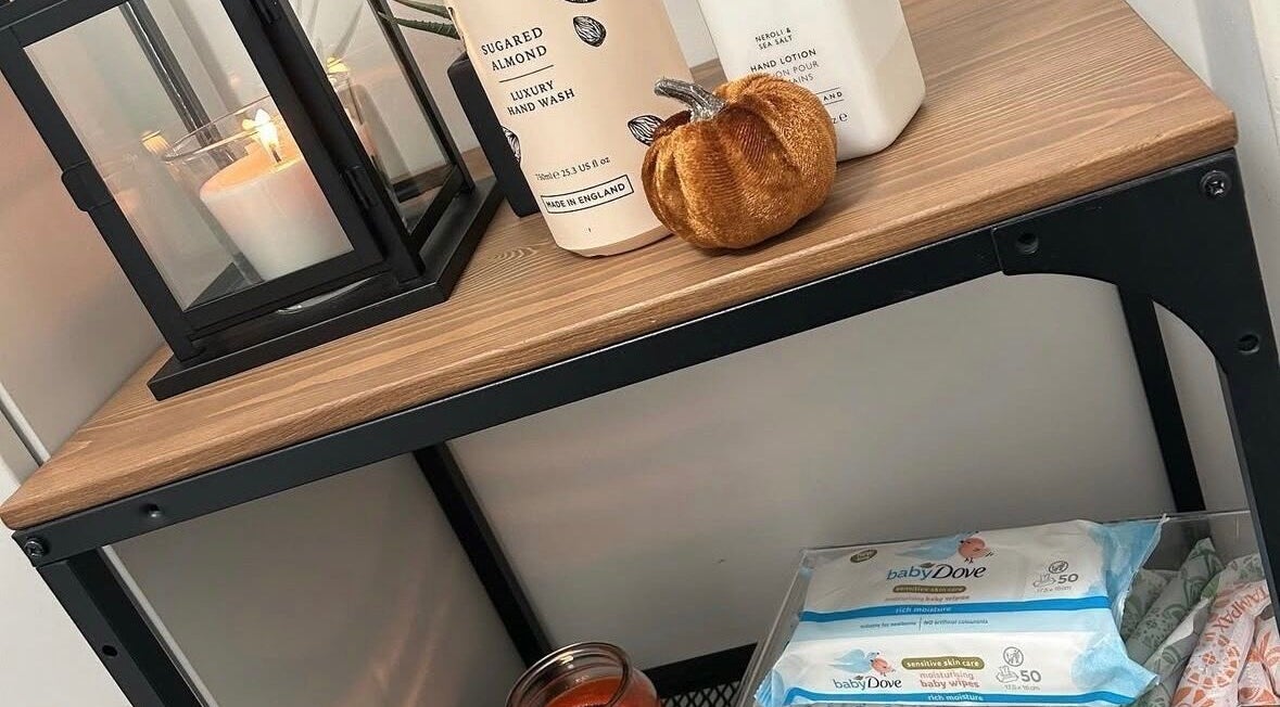 Chic shelf at Eden By Elizabeth, Newton-le-Willows, England, GB with luxury hand wash and candle for a cozy ambiance.