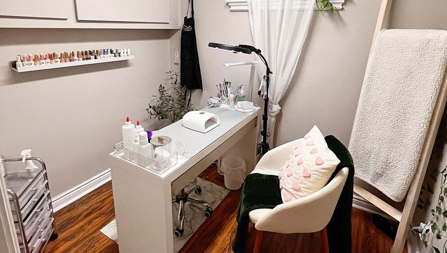 Cozy nail station at The Lacquer Lounge in St. Catharines, Ontario, CA, featuring elegant decor and nail tools.