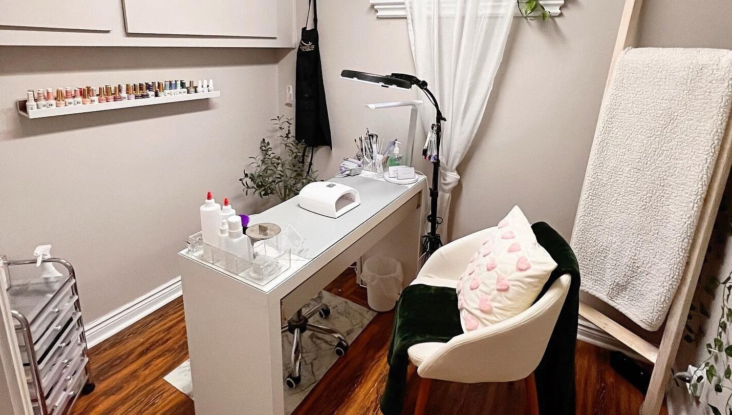 Cozy nail station at The Lacquer Lounge in St. Catharines, Ontario, CA, featuring elegant decor and nail tools.